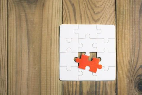 A puzzle piece is missing from a puzzle Stock Photos
