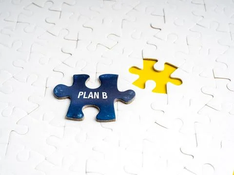 Puzzle piece with Plan B next to yellow missing spot on white puzzle backgr.. Stock Photos