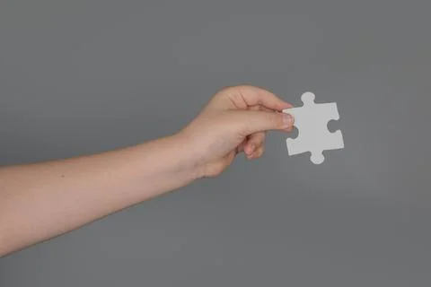 Puzzle piece represents missing creative link. Puzzle concept supports strategy Stock Photos