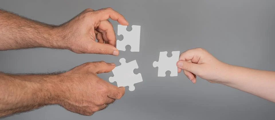 Puzzle pieces create teamwork solution concept. Puzzle assembly shows planning Stock Photos