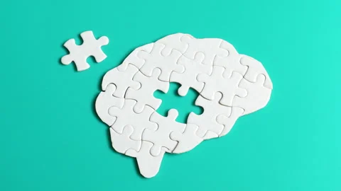 Puzzle Pieces Forming a Brain on Turquoise Background Stock Footage 295111343