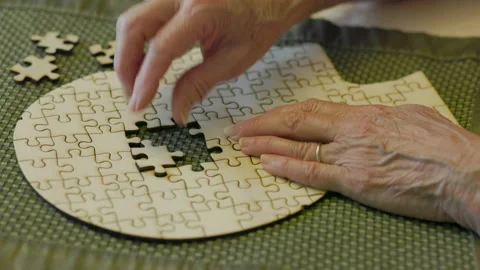 Puzzle pieces removed for concept of memory or brain function loss Stock Footage 305711025
