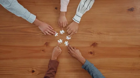 Puzzle, problem solving and hands of business people in office for corporate Stock Footage 312316490