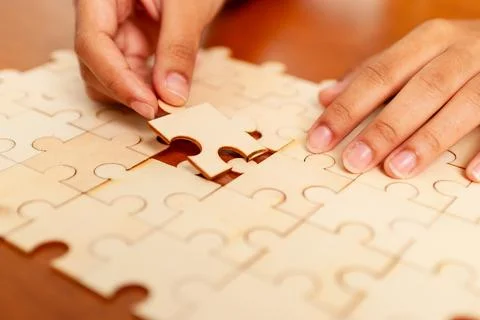 Puzzle solving activity home indoor close-up cognitive skills development Stock Photos
