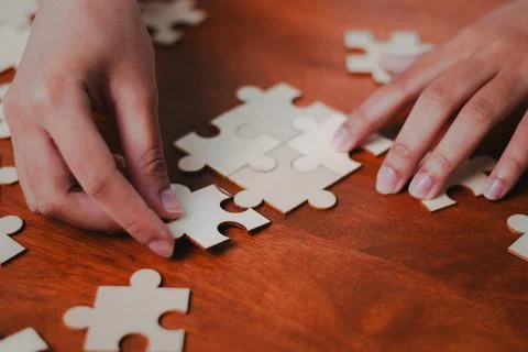 Puzzle solving business strategy workshop office space interactive learning.. Stock Photos