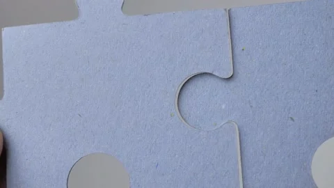 Puzzle Two hands connecting a couple. One part of the whole is a symbol of Stock Footage 224757036