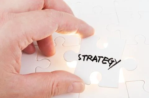 Puzzle which written strategy Stock Photos