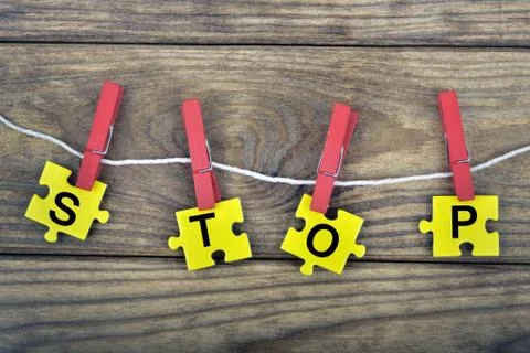 Puzzle with word Stop Photos