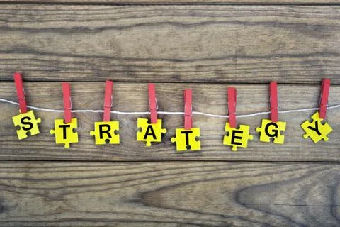 Puzzle with word Strategy Stock Photos