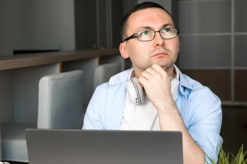 Puzzled asian man using laptop for work,education,programming etc. Stock Photos