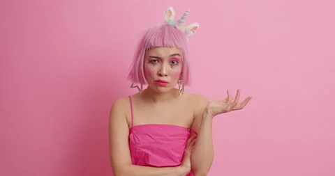 Puzzled Asian woman asks so what shakes head and looks dissatisfied at camera Stock Footage 147522052