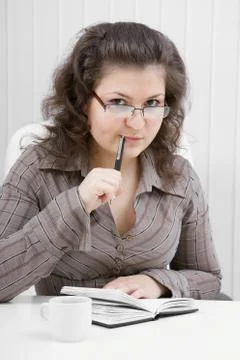 The puzzled girl with notebook and the handle Stock Photos