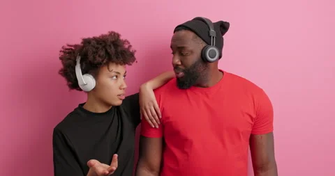 Puzzled hesitant dark skinned Afro American woman and man sort out relationship Stock Footage 151617493