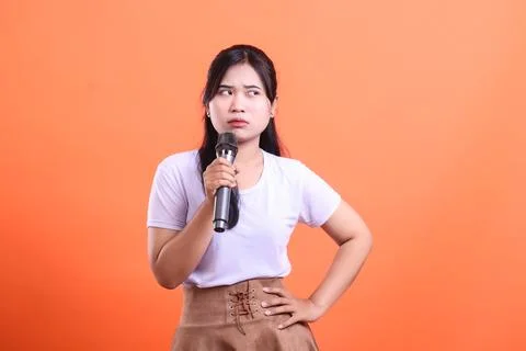 Puzzled Host with Microphone Stock Photos