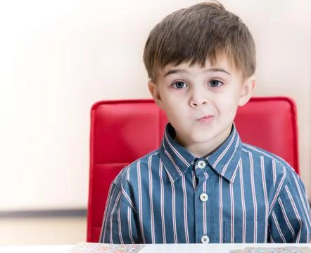 Puzzled little boy Stock Photos
