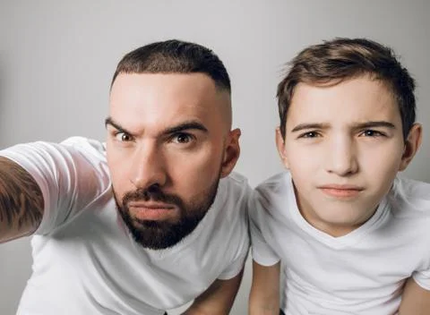 Puzzled two brothers are taking photos Stock Photos