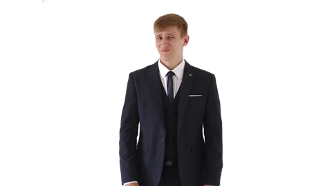 Puzzled young man 20 years old in a white dress shirt and classic, isolated on a Stock Footage 134315158