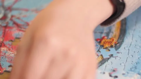Puzzler Finding the Correct Puzzle Piece Stock Footage 148540563