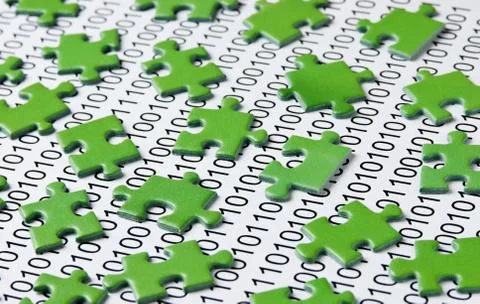 Puzzles and binary code Stock Photos