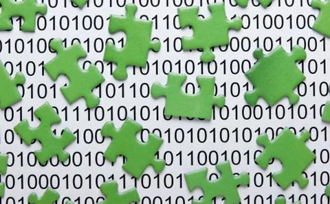 Puzzles and binary code Foto stock