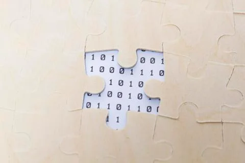 Puzzles and binary code, teamwork, career success Foto stock