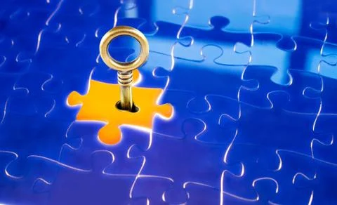 Puzzles and keys Stock Photos