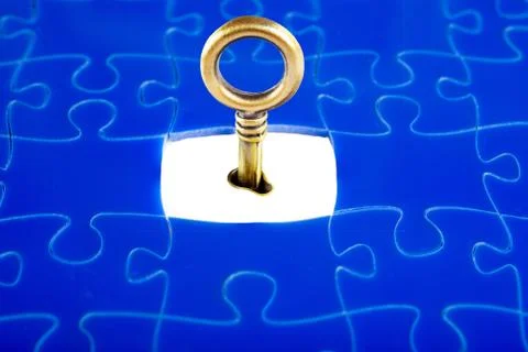 Puzzles and keys Stock Photos