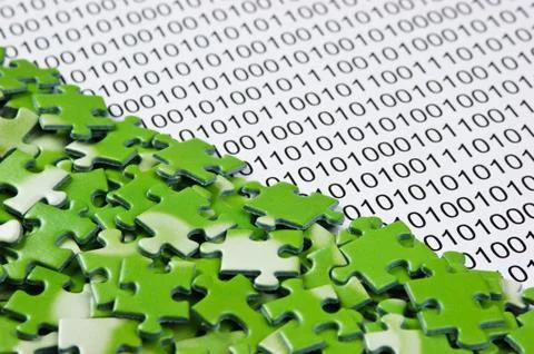 Puzzles on a binary code Stock Photos