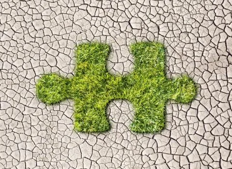 Puzzles from grass on cracked earth background Stock Illustration