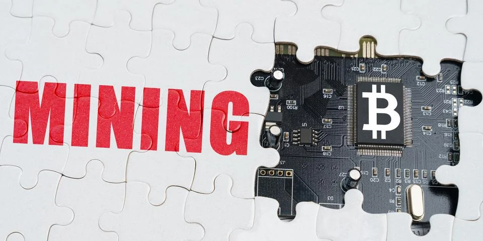 On the puzzles there is a processor with a bitcoin symbol and it says - Minin Stock Photos