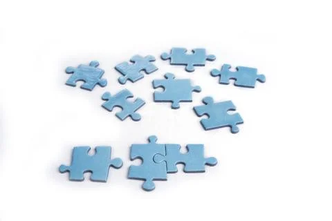 Puzzles on a white background. Solution and teamwork concept Stock Photos