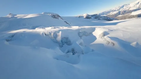 PV drone closely flies over a glacier and its crevasses on a French mountain Stock Footage 253554957