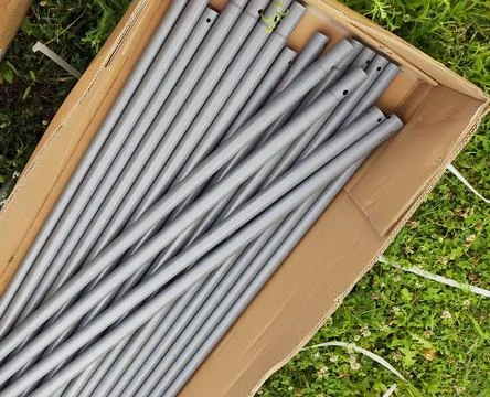 PVC pipes arranged in a construction environment ready for installation. Du.. Stock Photos