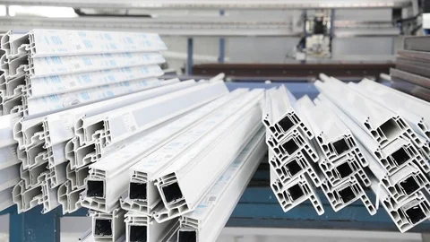 PVC windows and doors sections waiting for assembly - dolly Stock Footage 75575191