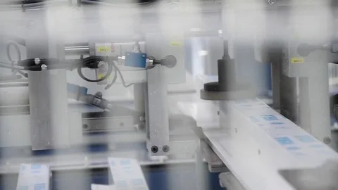 PVC windows and doors sections on the automatic line machinery for screws -dolly Stock Footage 75575375