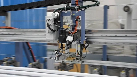 PVC windows automatic line machine cutting sections Stock Footage 75574106