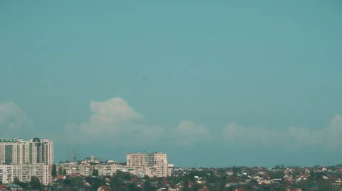 Pylons of the old electricity in fields and a lake with buildings on background Stock Footage 64993039