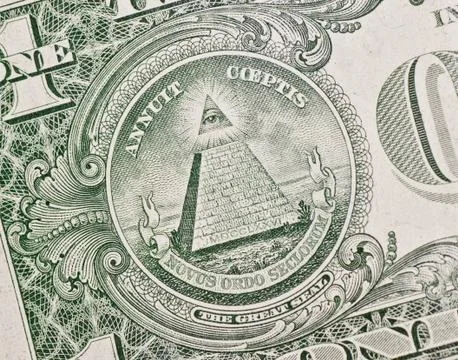 The pyramid and eye on the back of a one dollar bill. Stock Photos