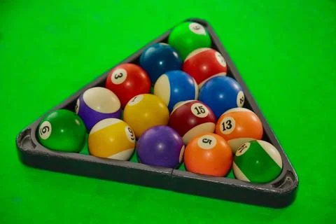 Pyramid of balls on a pool table, starting position for a pool game, balls on Stock Photos