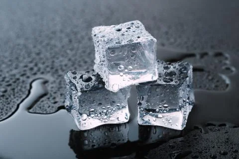 Pyramid of beautiful thawed ice cubes with drops of water Stock Photos