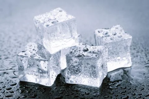 Pyramid of beautiful thawed ice cubes with drops of water Stock Photos