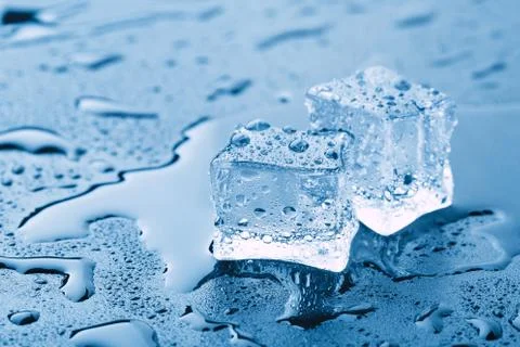 Pyramid of beautiful thawed ice cubes with drops of water Stock Photos