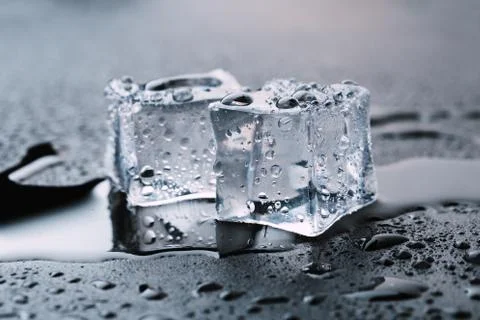 Pyramid of beautiful thawed ice cubes with drops of water Stock Photos