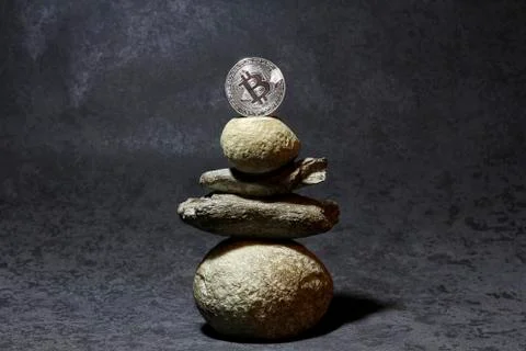 Pyramid with bitcoin on a gray background Stock Photos
