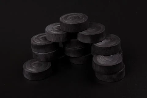 Pyramid of black chips backgammon for playing backgammon on black background. 写真素材
