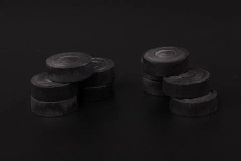 Pyramid of black chips backgammon for playing backgammon on black background. 写真素材