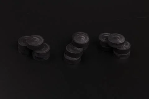 Pyramid of black chips backgammon for playing backgammon on black background. 写真素材