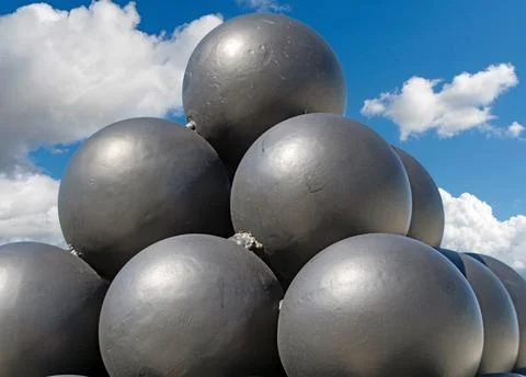 A pyramid of black solid shots Foto stock