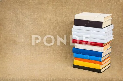 Pyramid from books on a canvas Stock Photos