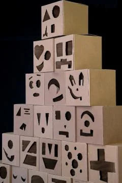 Pyramid from boxes on a black background Stock Photos
